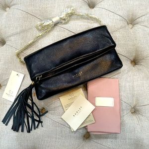 NWT Black leather fold-over clutch with gold chain by Radley London.